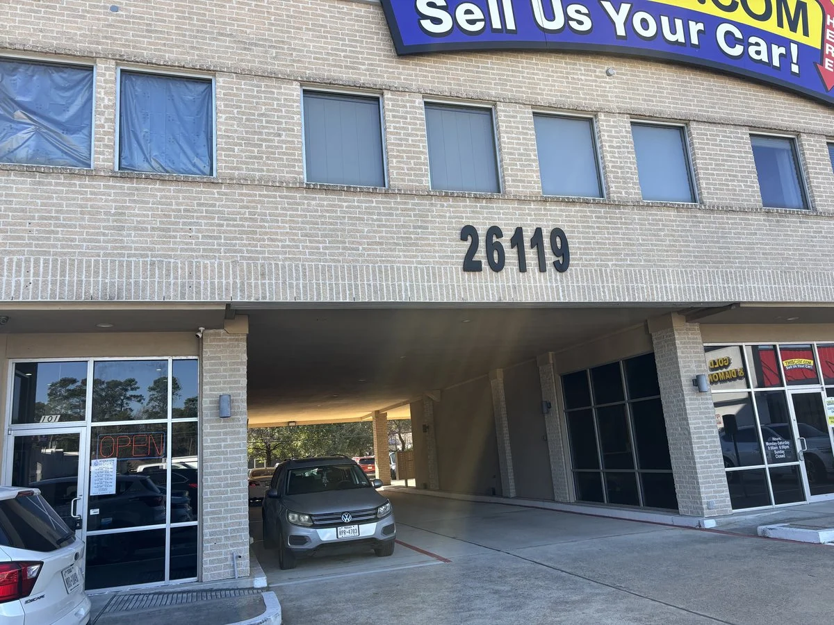 Polished by Kim studio entrance archway in Spring, TX - drive through this archway to access studio parking