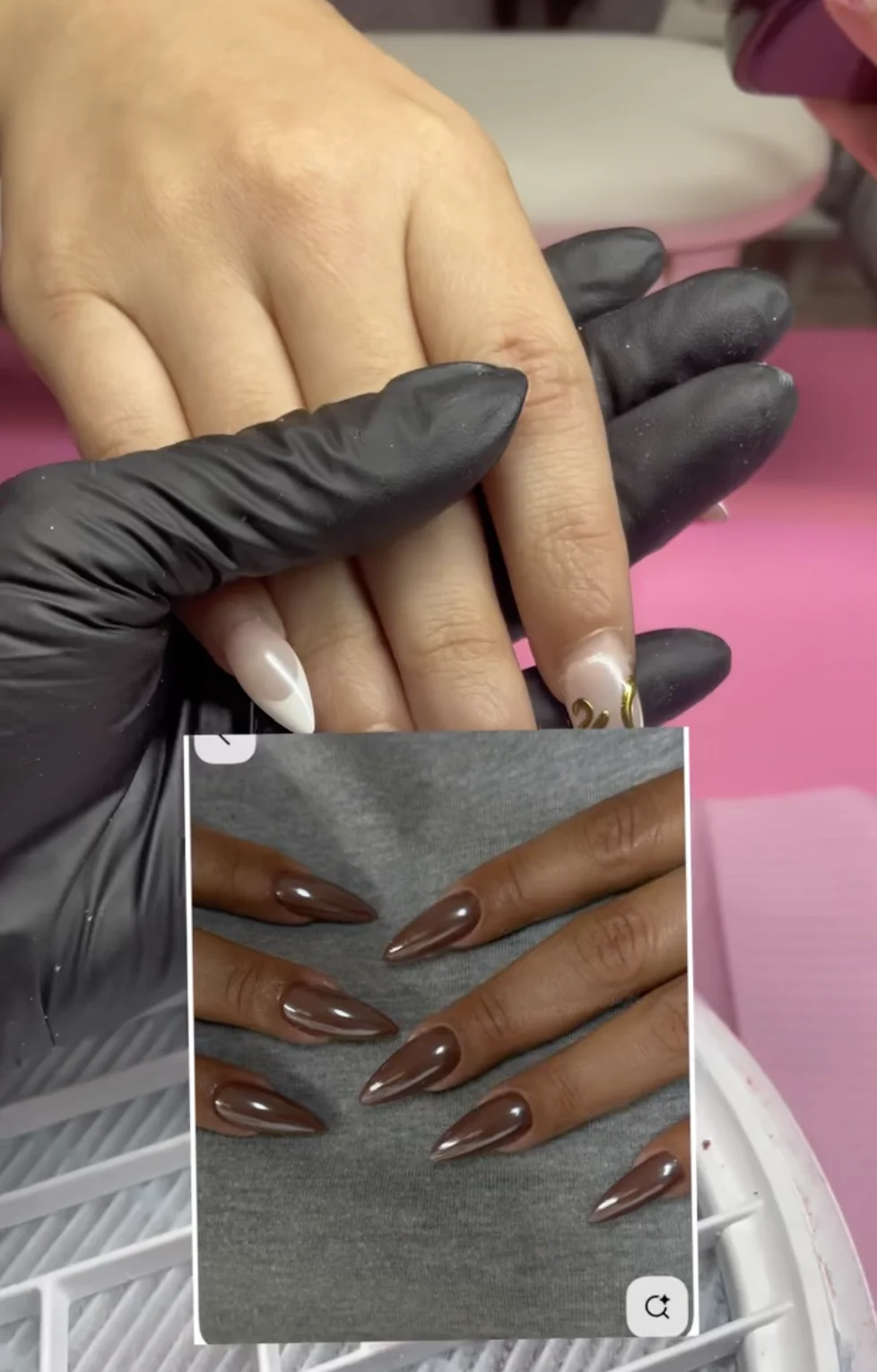 Client showing brown chrome nail inspiration photo